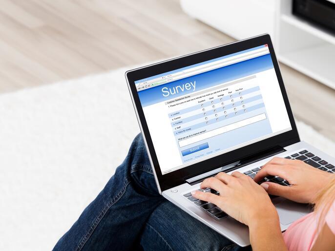 A woman browsing on a laptop