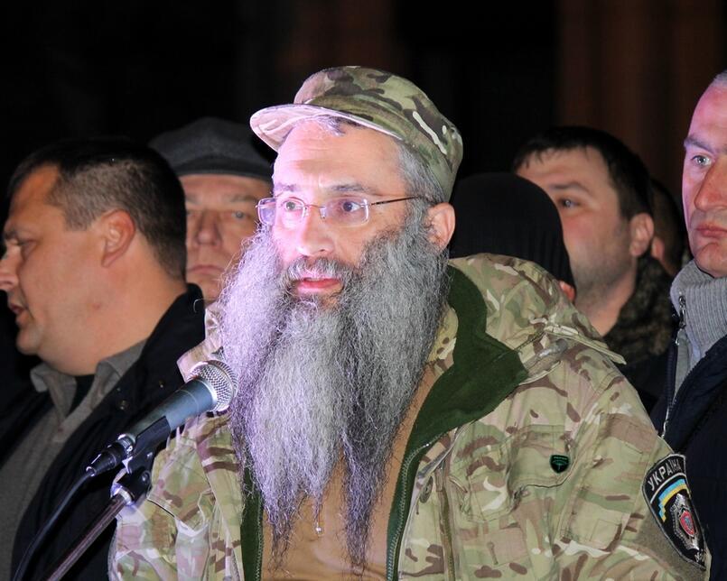 A Rabbi in Ukrainian military outfit, speaks to Ukrainian Army forces