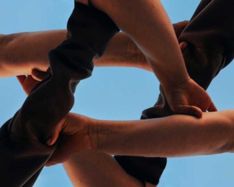 Hands creating a Magen David