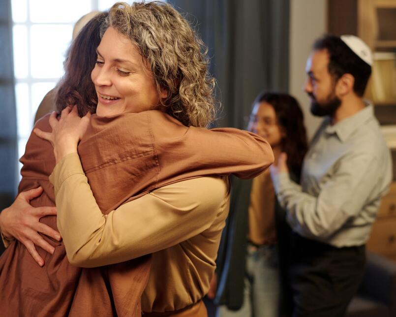 Two Jewish women hugging