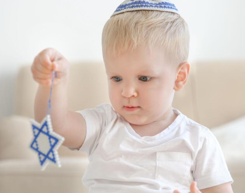 Baby holding a Magen David