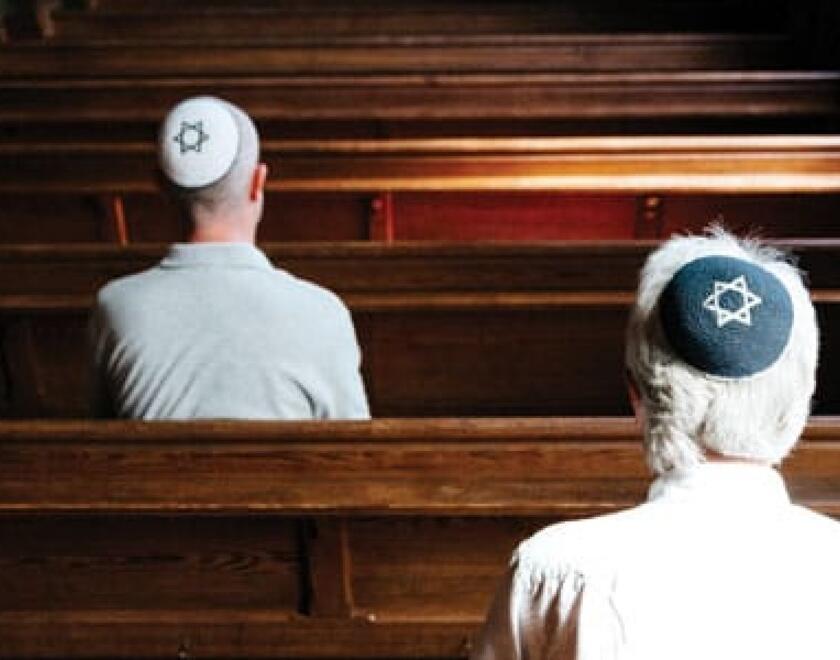 Jews sitting in a synagigue