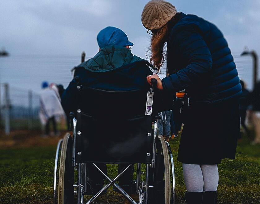 Elderly woman with wheelchair