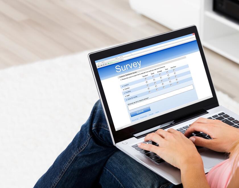A woman browsing on a laptop