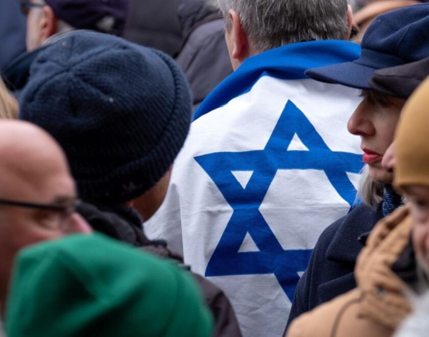 Israeli flag among a crowd in the UK