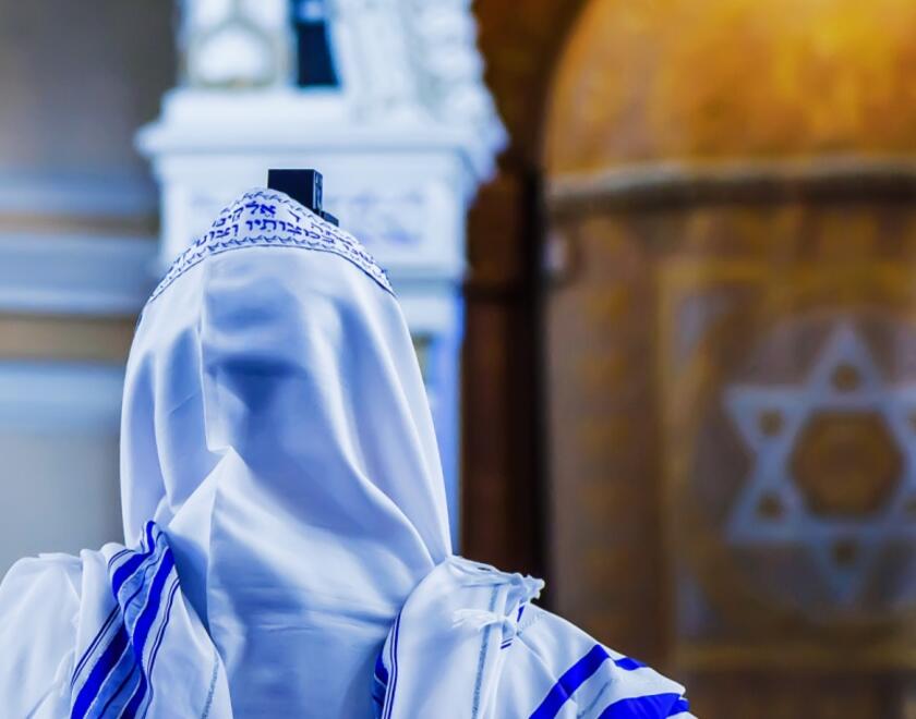 Man praying in a synagogue