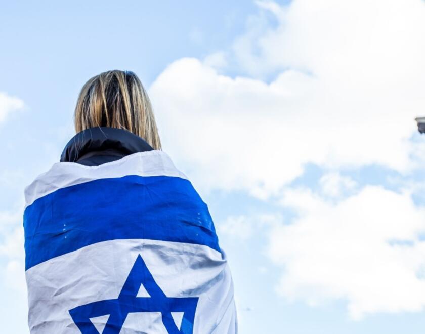 Jewish woman with Israeli flag in London