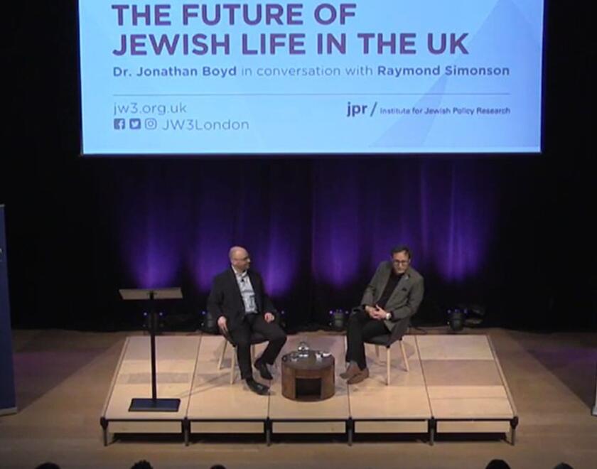 Dr Jon Boyd and Raymond Simonson on stage