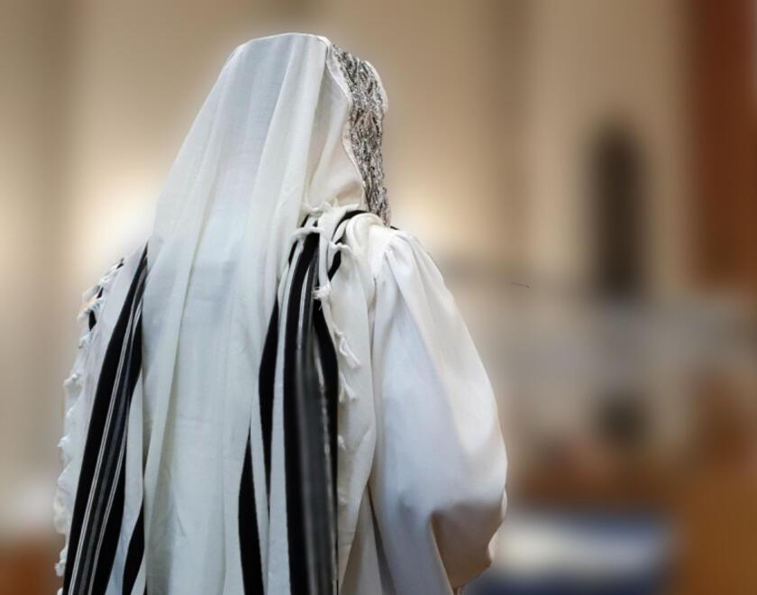A man praying inside a synagogue