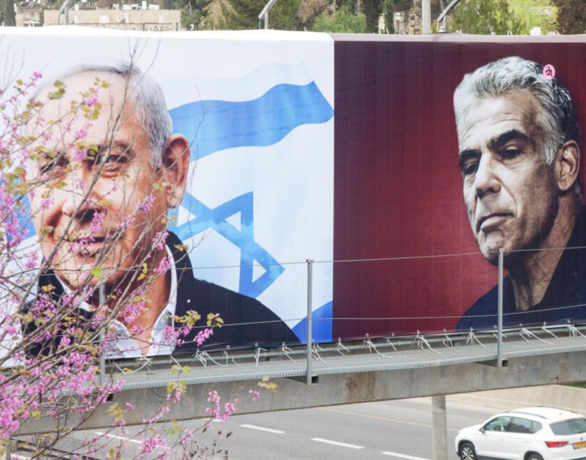 Netanyahu and Lapid on campaign signs