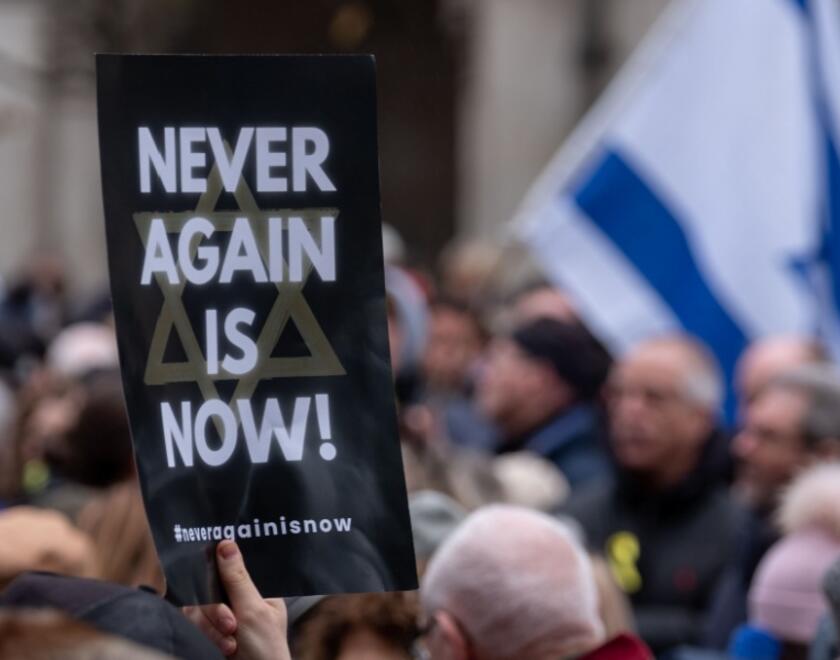 A 'never again is now' sign