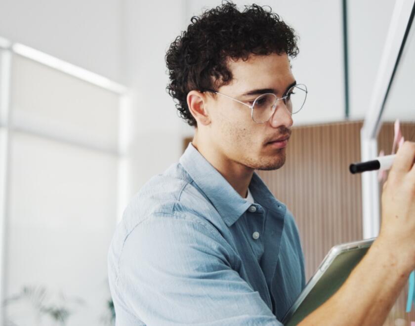 Young researcher writing questions