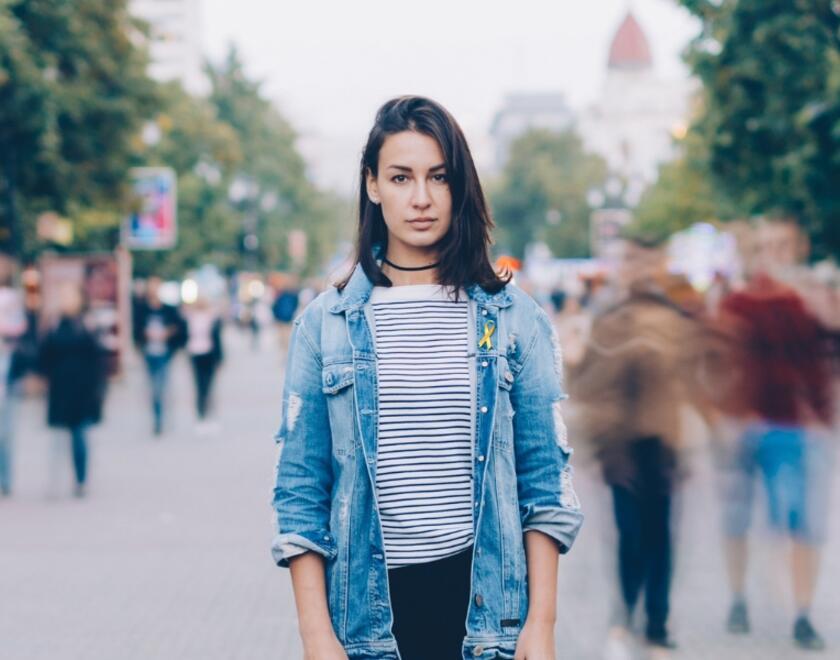 Young Jewish woman standing in a crowd