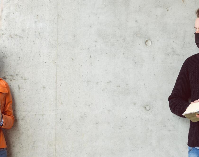 Young man and woman with masks